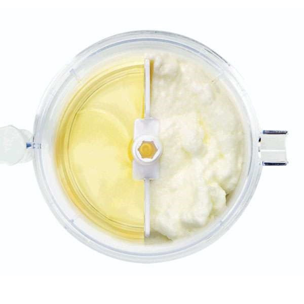 top view of food processor blender with half whole egg whites and half blended egg whites