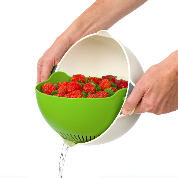 bowl colander draining water from strawberries