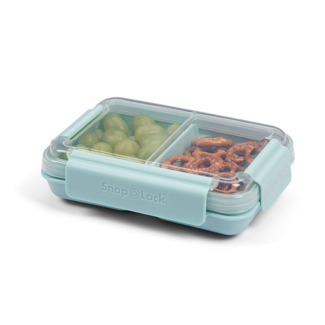 light blue plastic food container for lunch and snack storage with divider separating green grapes and pretzels