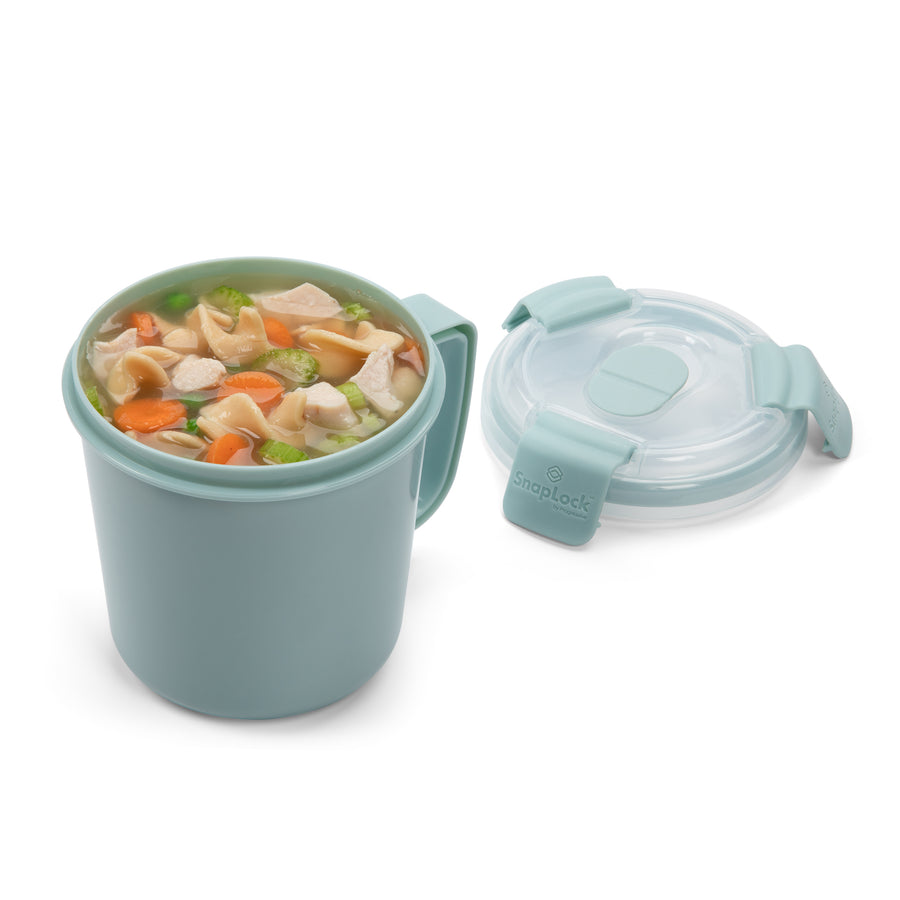 light blue food storage container for soup with chicken noodle soup in cup and lid sitting beside it