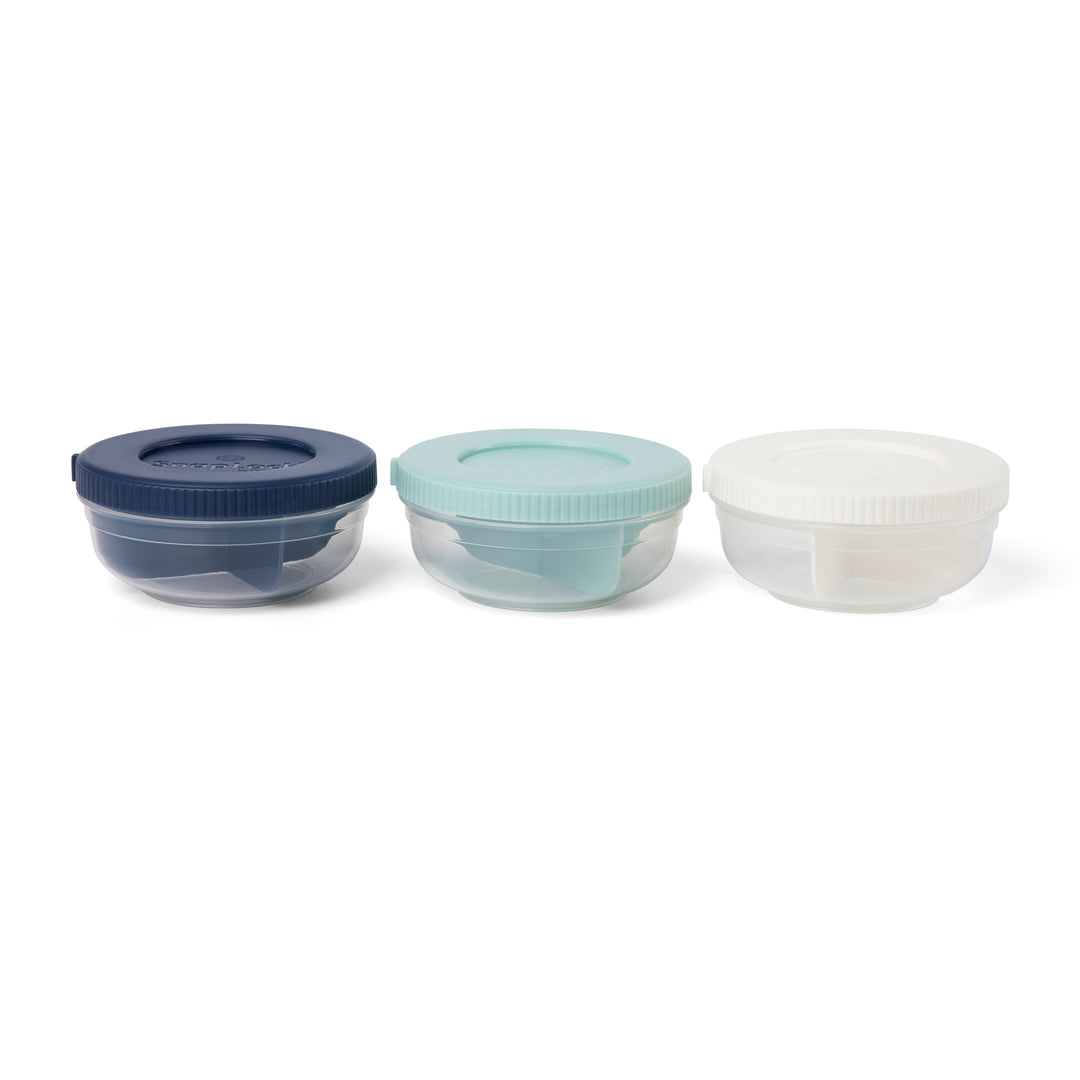 three plastic food storage containers for snacks, side by side, in navy, mint, and white colors