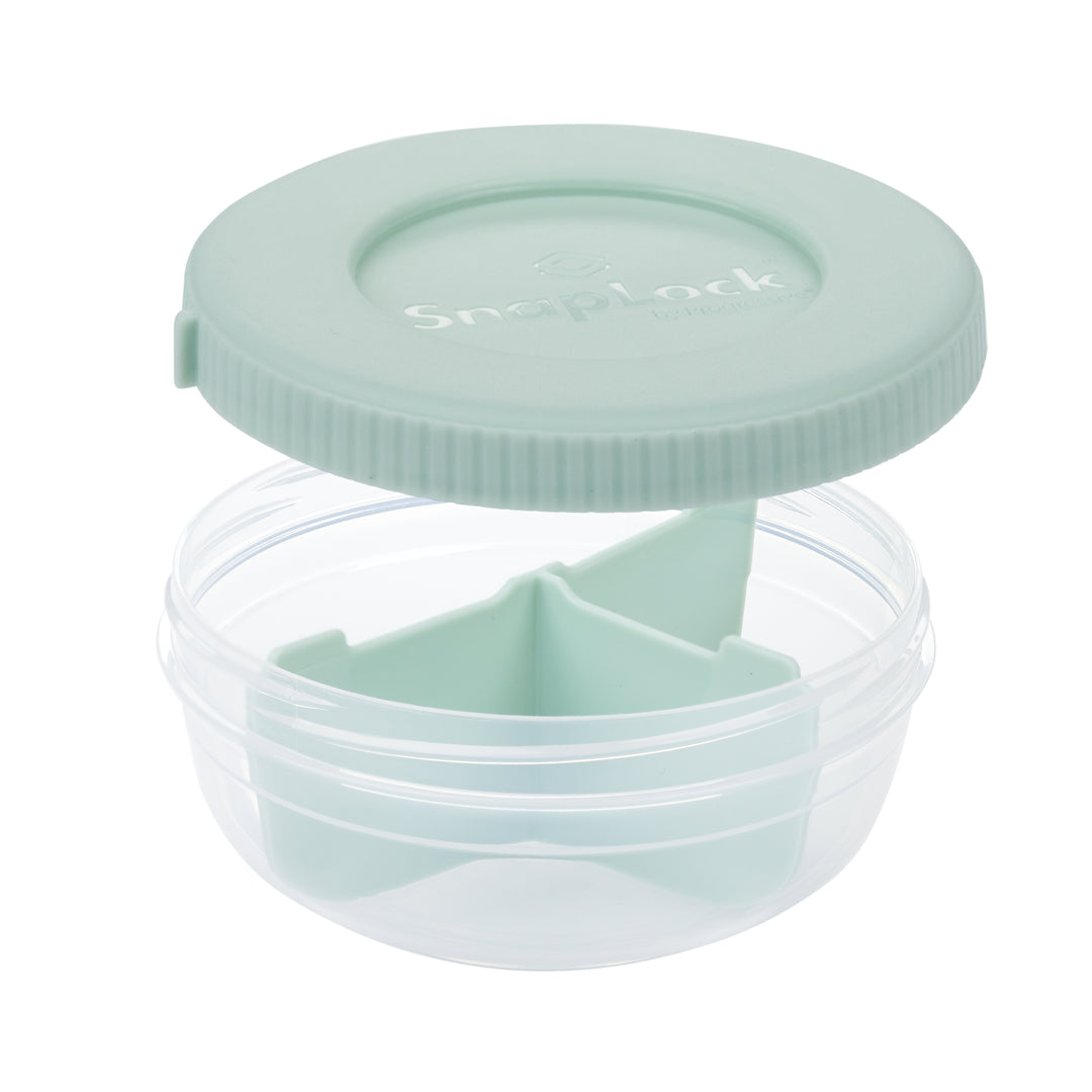 empty plastic food storage container for snacks in mint color with lid removed revealing a plastic divider and three compartments for snack storage