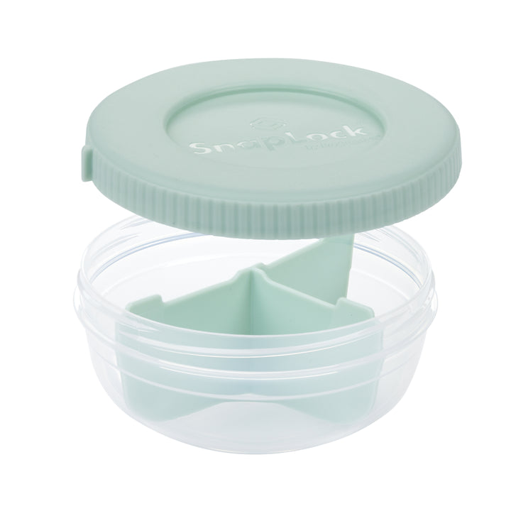 empty plastic food storage container for snacks in mint color with lid removed revealing a plastic divider and three compartments for snack storage