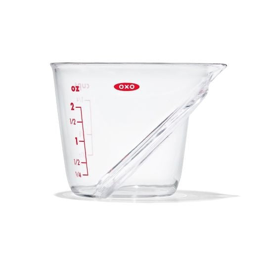 2 oz clear plastic measuring cup with red markings