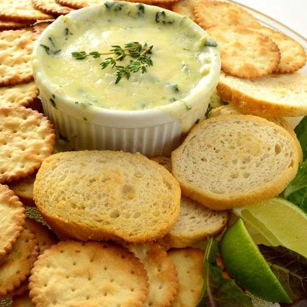 creme brulee ramekin dish with spinach dip for chips and crackers