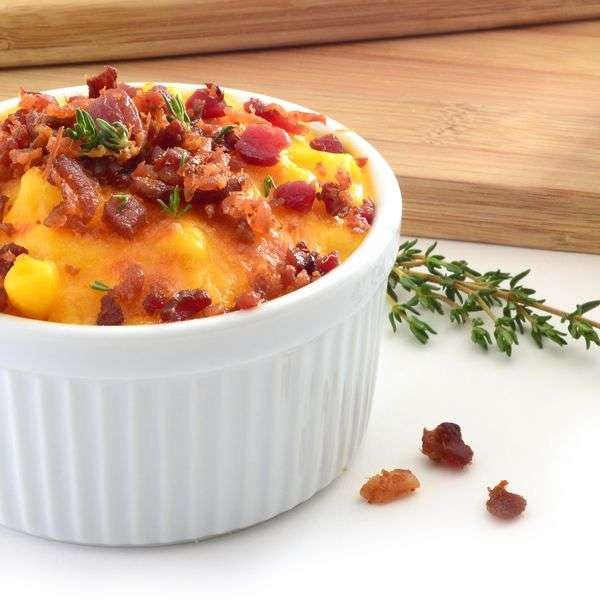 ramekin dish with quiche and bacon bits on top