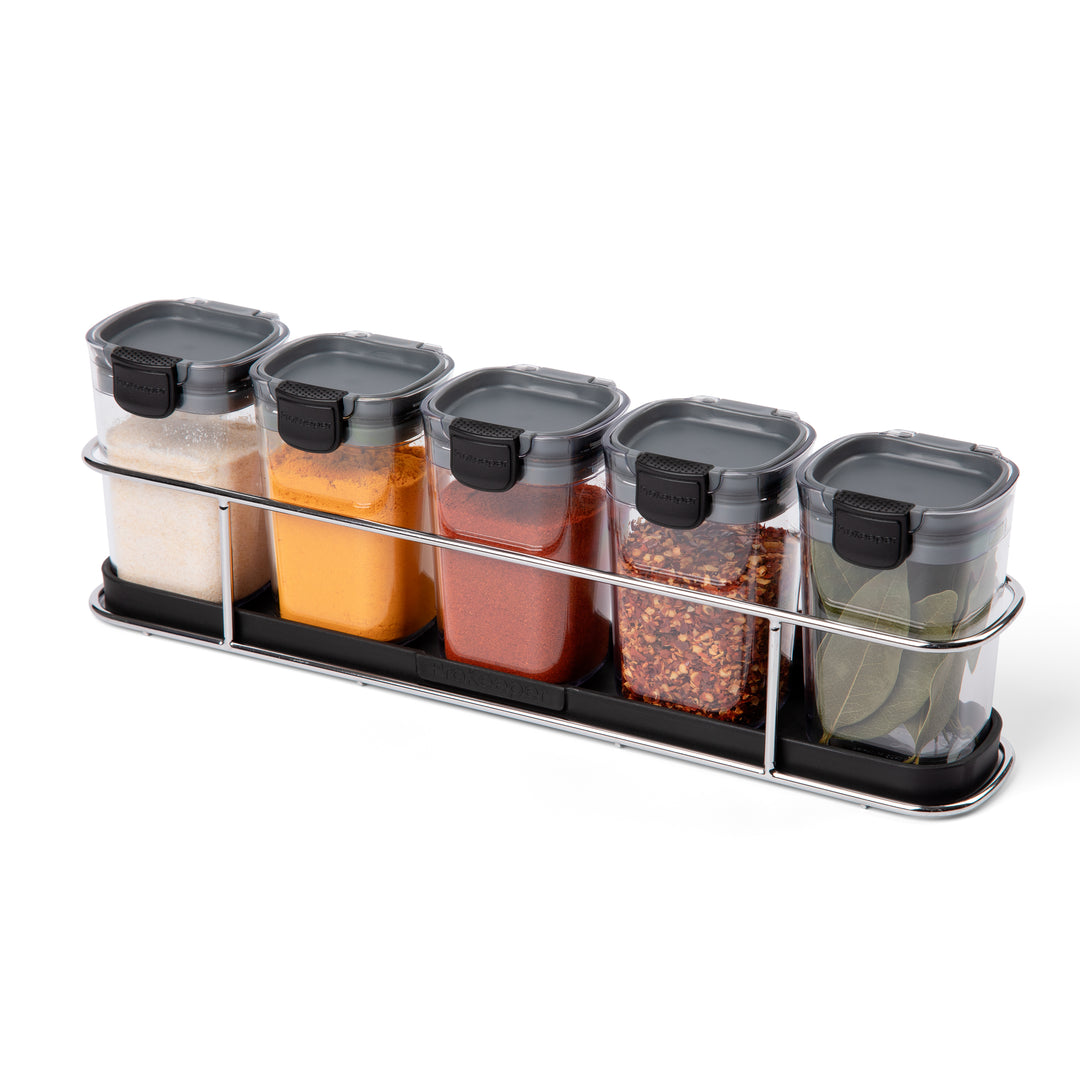 spice jars with spices in organizer rack